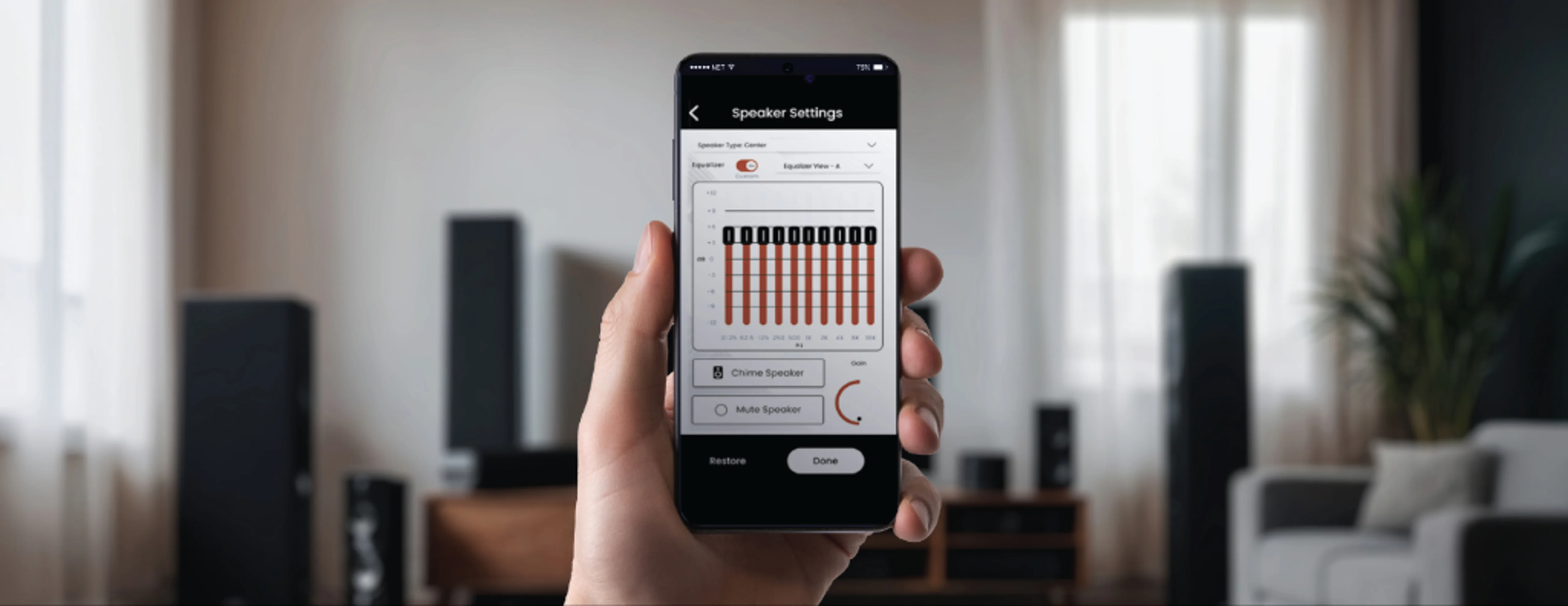 Hand holding a phone open to speaker settings